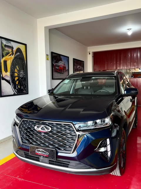 SUV Chery preta na área de entrega da oficina de funilaria em Presidente Prudente